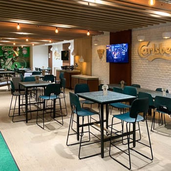 Carlsberg lounge in Anfield furnished with Fusø tables and R.U.M chairs
